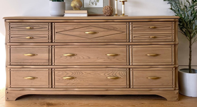 After picture of a 9 drawer dresser refinished in a blonde oak
