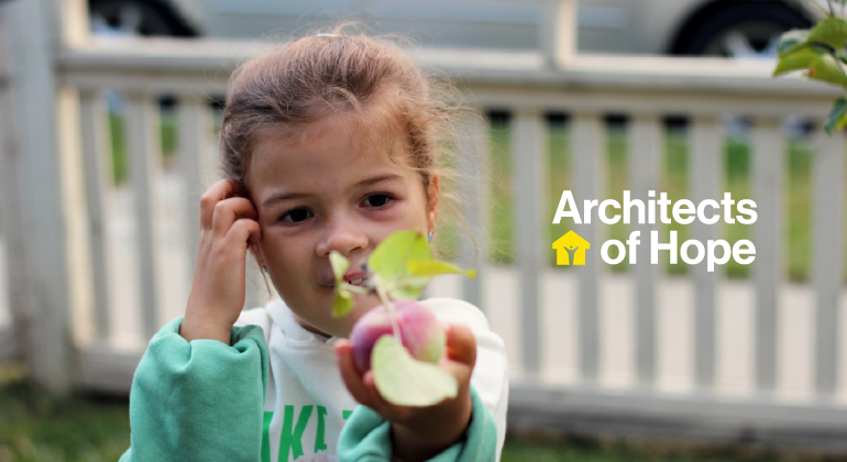 Young girl holding an apple