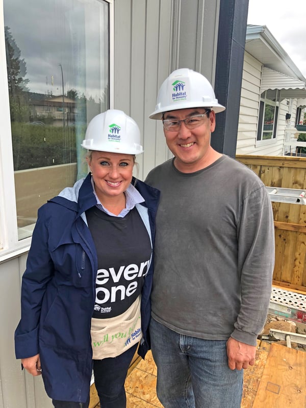 CREB Charitable Foundation's President Alyssa Campos with Habitat for Humanity's CEO Gerrad Oishi during a Build Day in Bowness