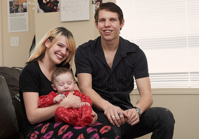 smiling family moving into their habitat home