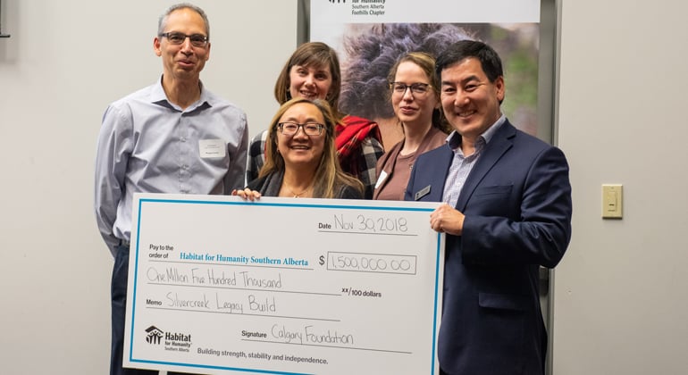 Calgary Foundation representatives present a cheque for $1.5 M to Habitat CEO