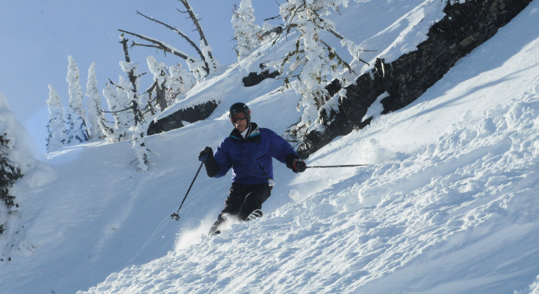 A man skiing down a mountain