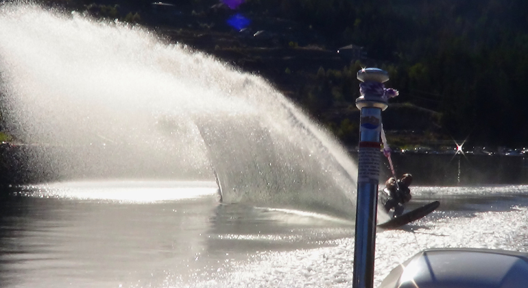A man waterskiing on a lake