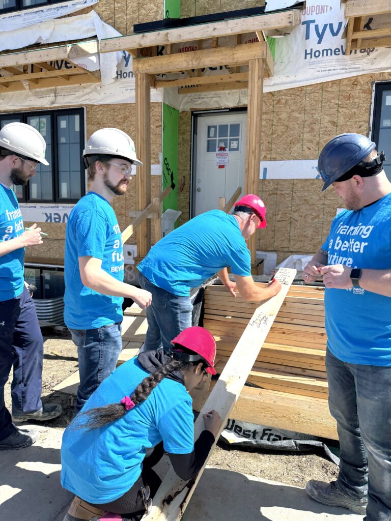 A group of volunteers building on a construction site