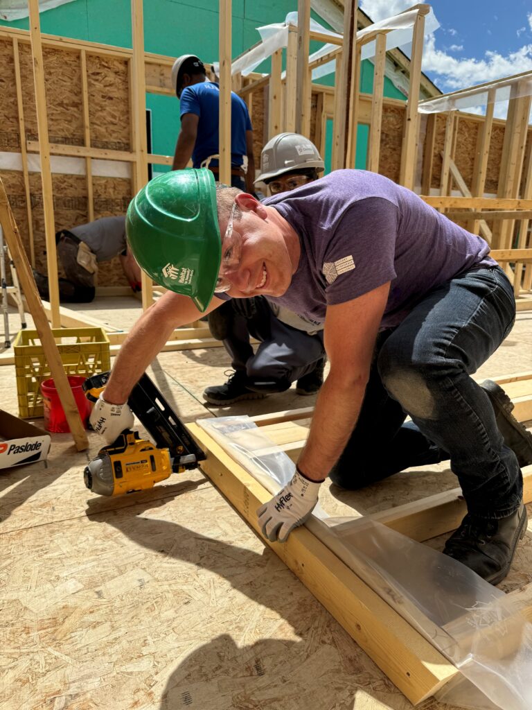 A man using a nail gun