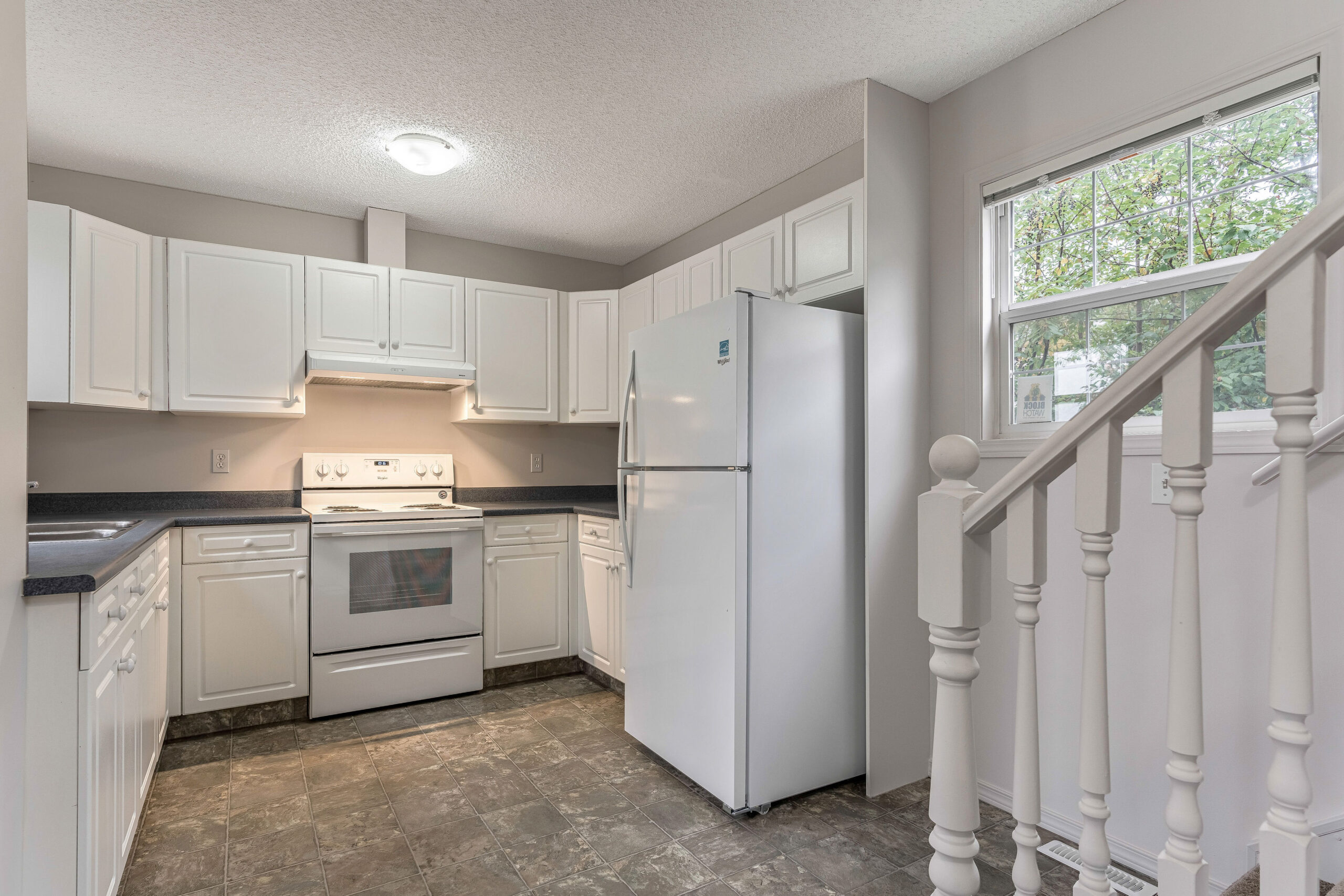 White kitchen in a Habitat home.