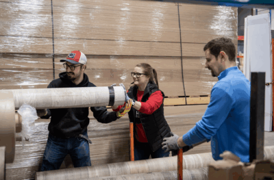 Three volunteers working at the ReStore