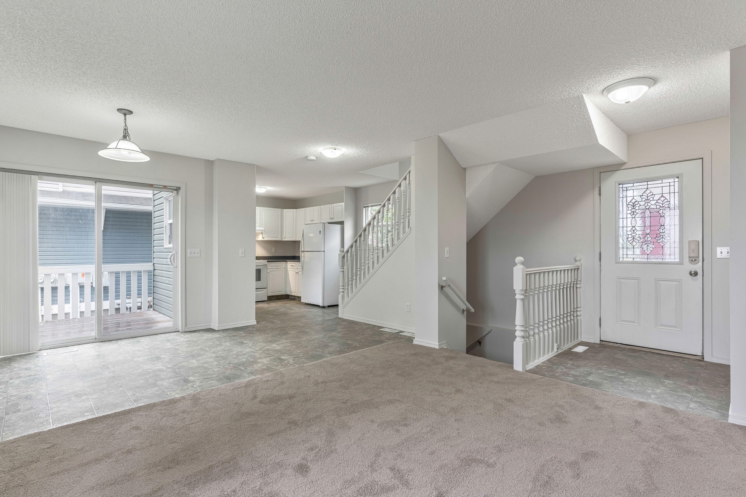 Vacant open concept main floor of a Habitat home in Calgary.