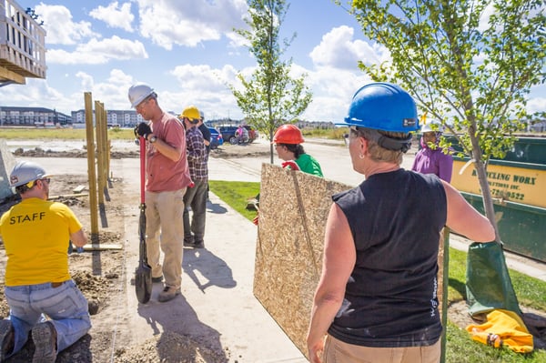 A group of volunteers working on a Habitat construction site.