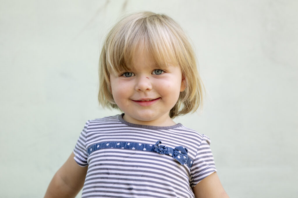 Young girl smiling at camera