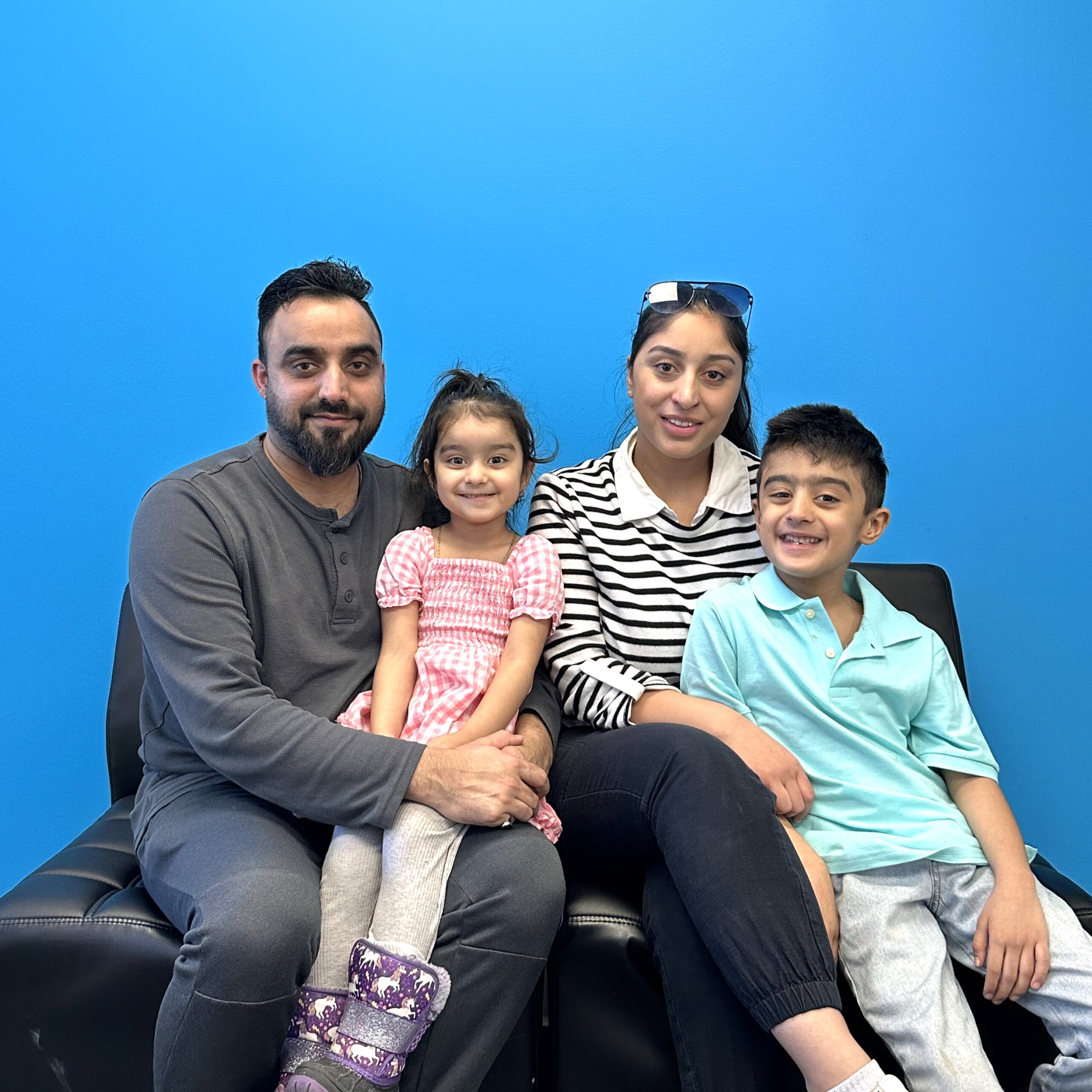 Muhammad with his wife and two kids.