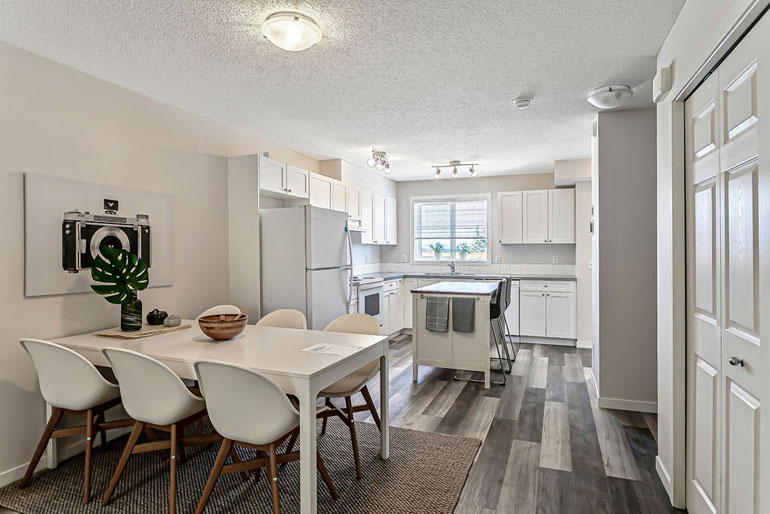 Inside Habitat for Humanity home showing dinirg room and kitchen