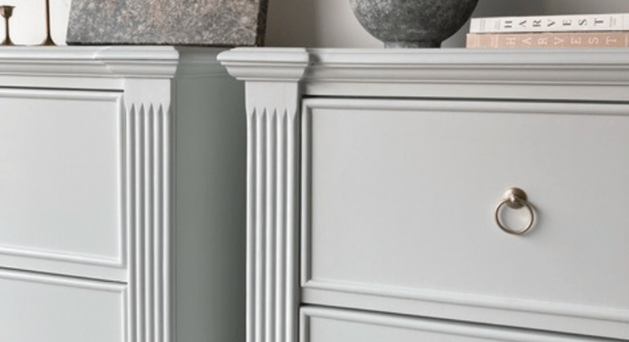 closeup of two white nightstands showing the fluted detailing