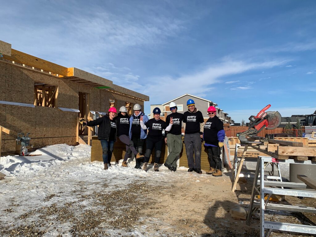 A group of volunteers on an outdoor construction site