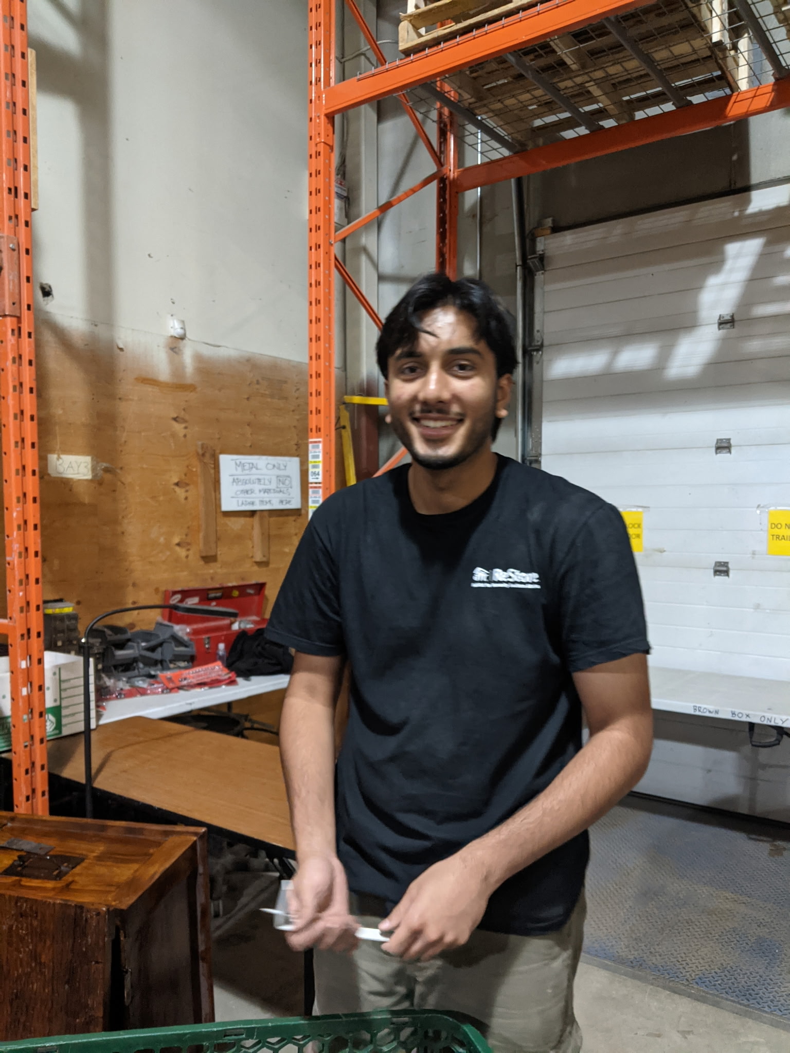 Volunteer Rehman in the Distribution Centre in ReStore.