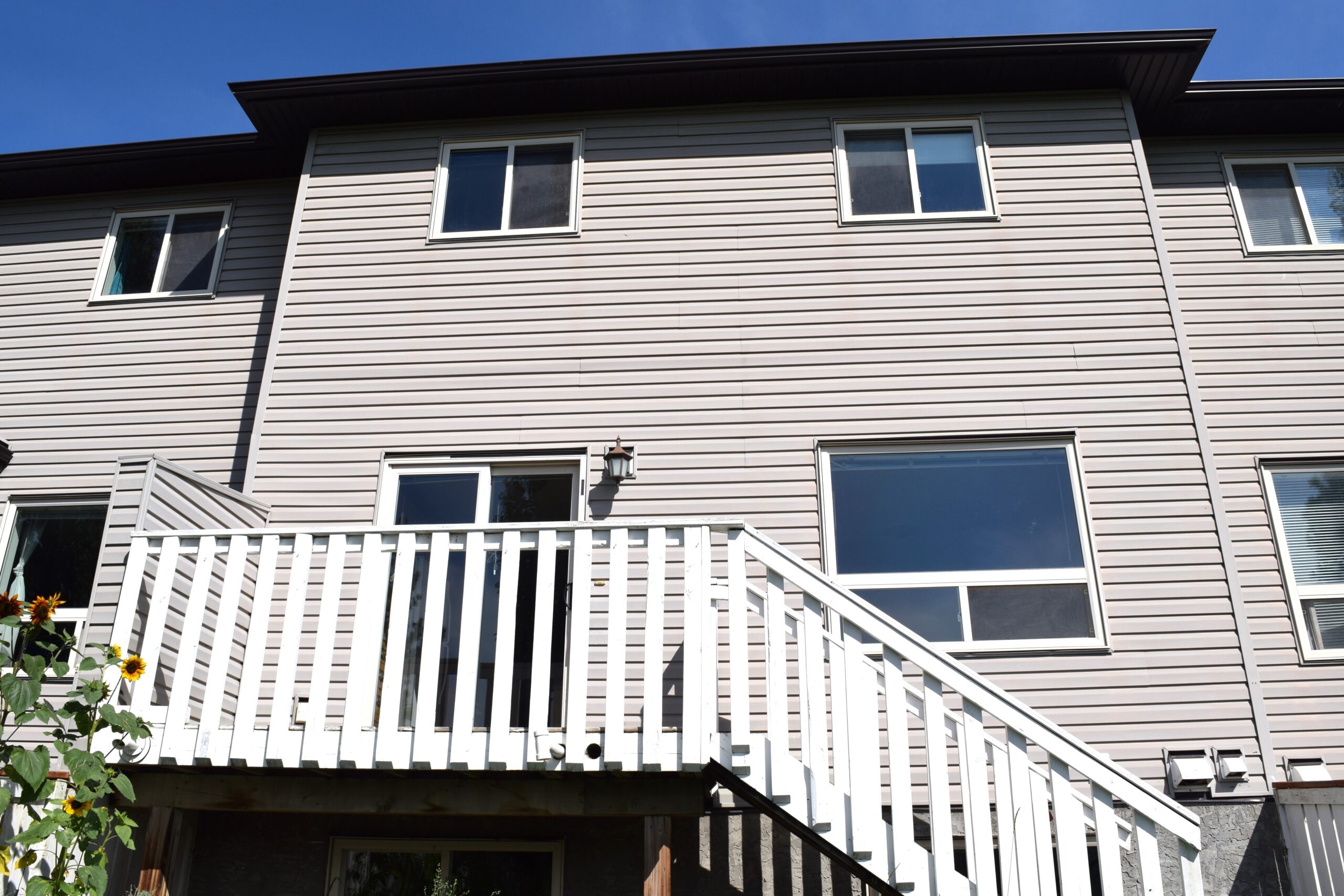 Back of a Habitat townhome in Cochrane.