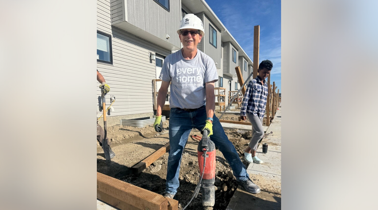 Volunteer Crew Leader Hugh operates a jackhammer on a Habitat build site in Calgary.