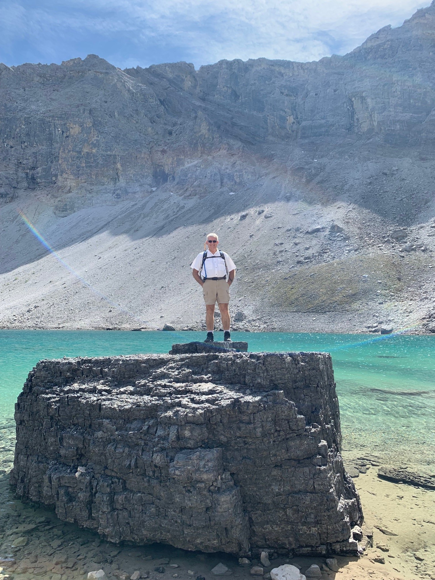 Steve on a large rock in the Rocky Mountains on a hike.