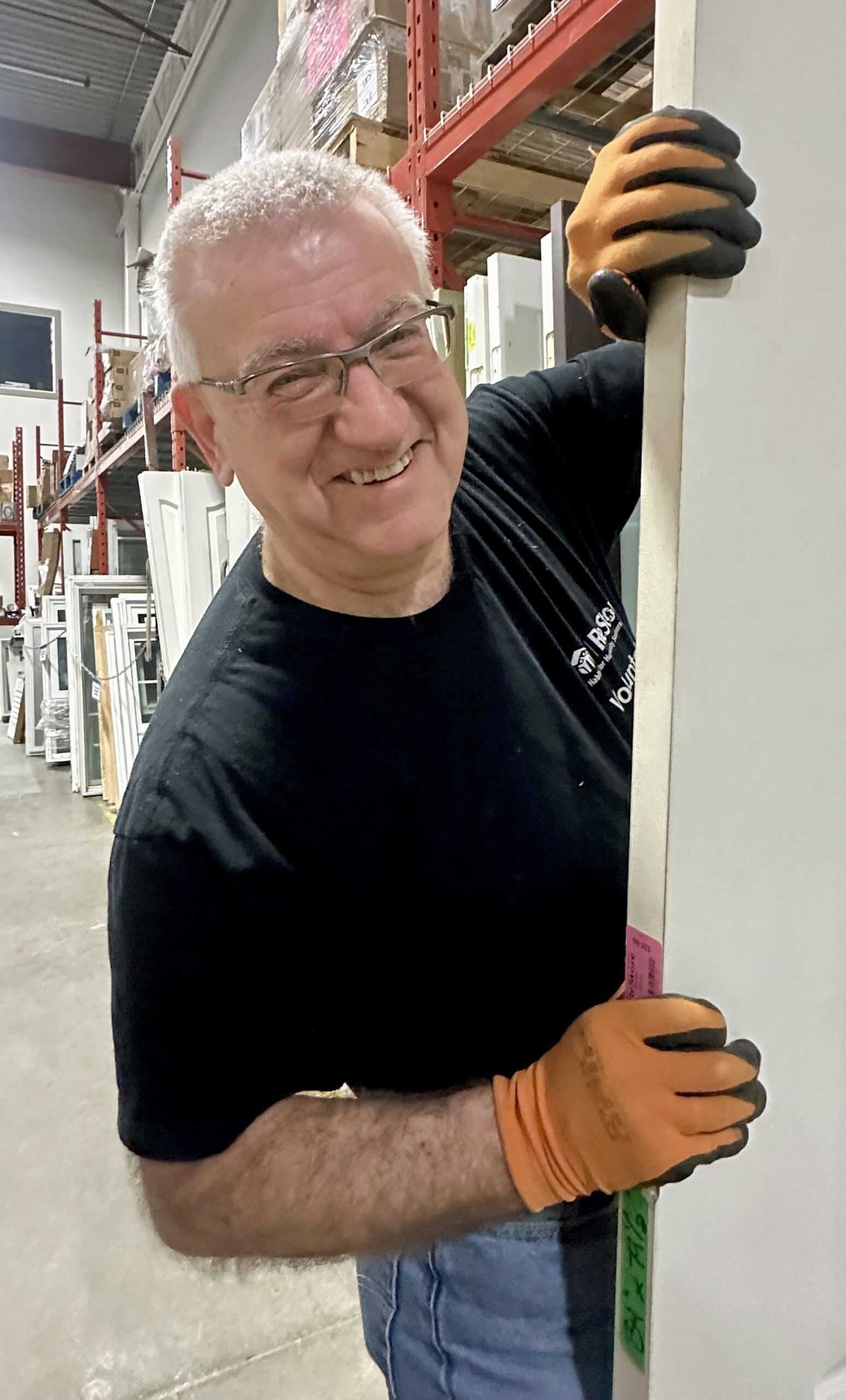 Steve peeks out from behind a door at ReStore.