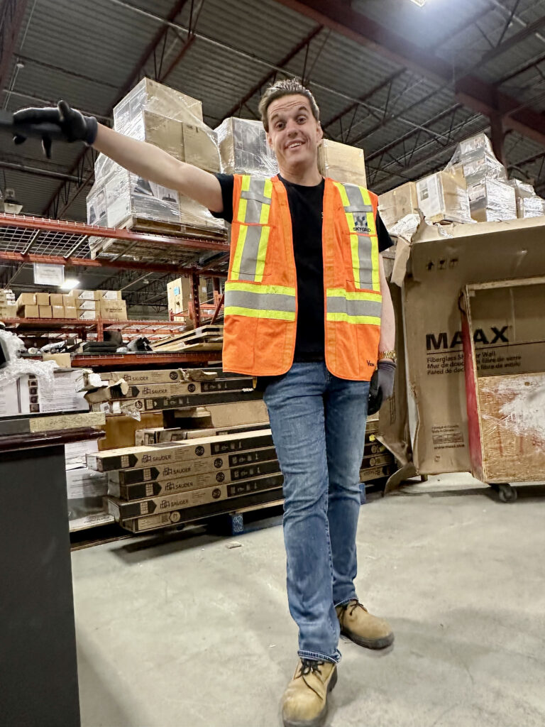 Volunteer JP wears a high visibility vest at ReStore.