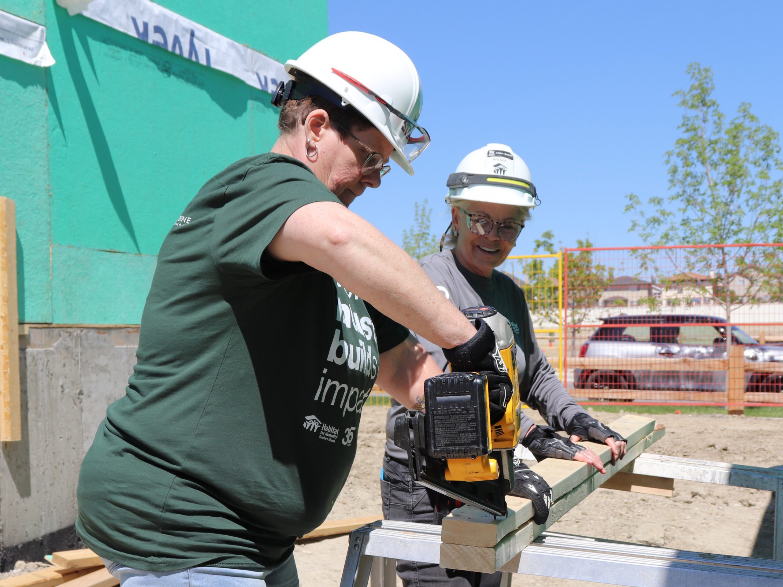 Two women building.