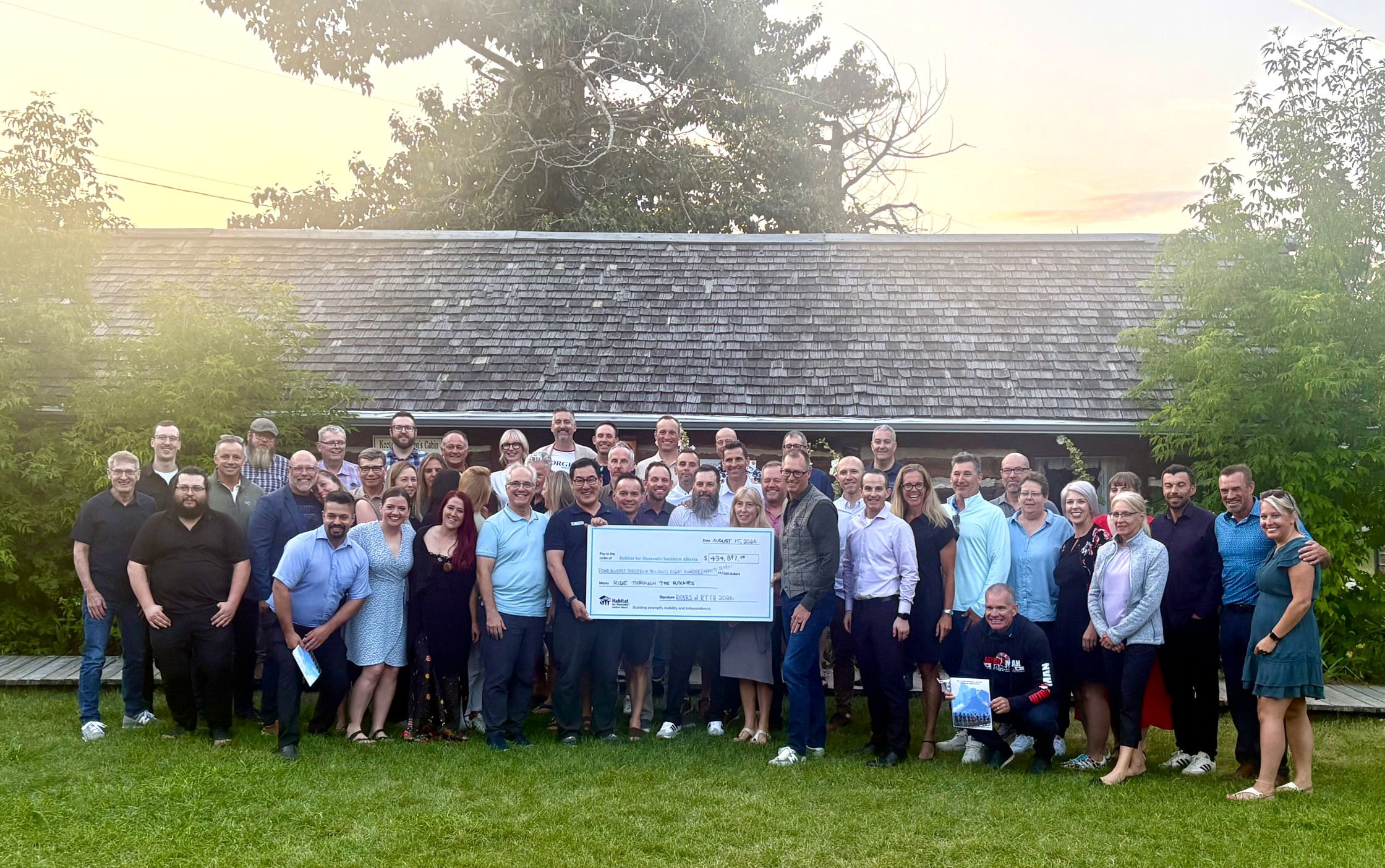 Group with a large cheque.