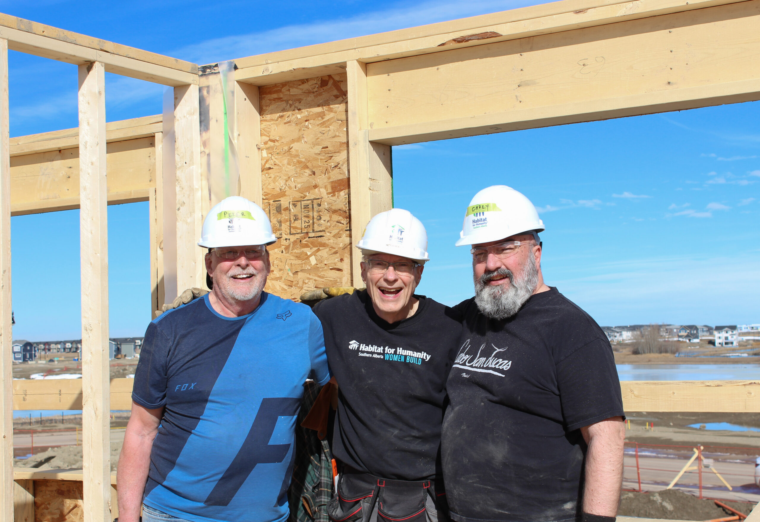 Three men on a construction site.